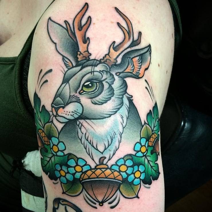 Colorful rabbit tatto with horns and plants