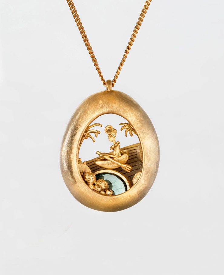 Miniature scenes encapsulated in gold and silver pendants