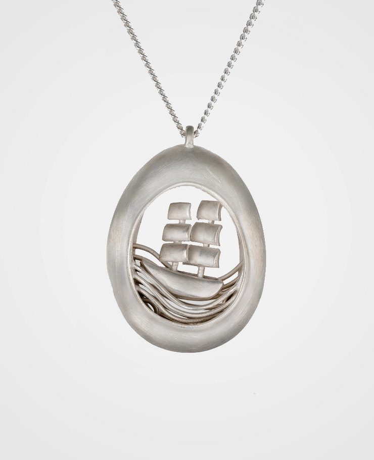 Miniature scenes encapsulated in gold and silver pendants