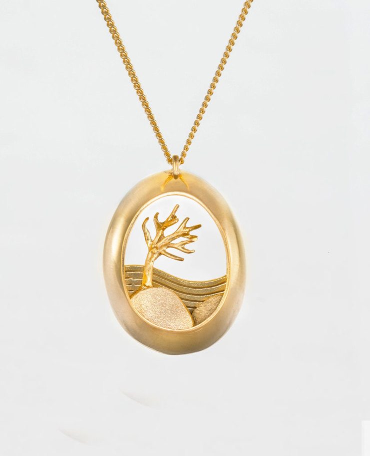 Miniature scenes encapsulated in gold and silver pendants