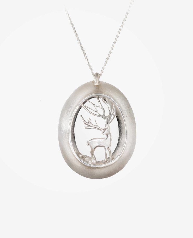 Miniature scenes encapsulated in gold and silver pendants