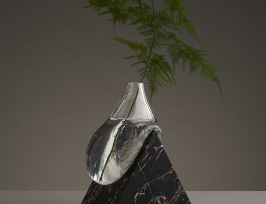 These Sculptural Glass Vases Appear To Melt On Angular Stone Forms